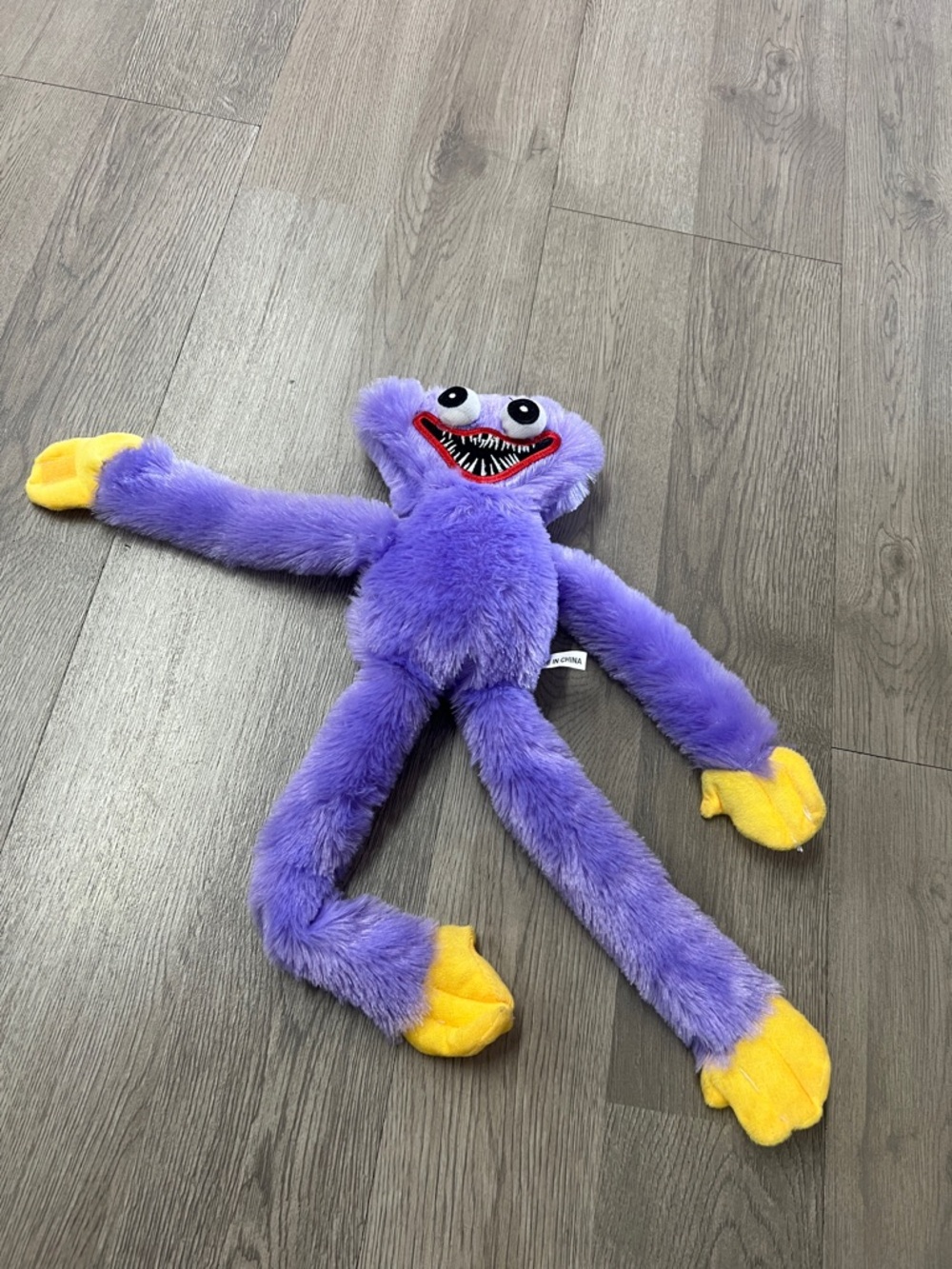 Purple Plush Monster Toy with Yellow Hands for Kids